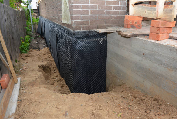 Happy homeowners after waterproofing job in Dowelltown